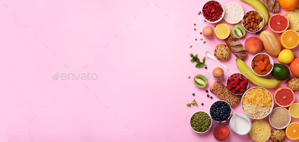 Organic food frame. Banner. Healthy breakfast ingredients. Oat and corn flakes, eggs, nuts, fruits - Stock Photo - Images