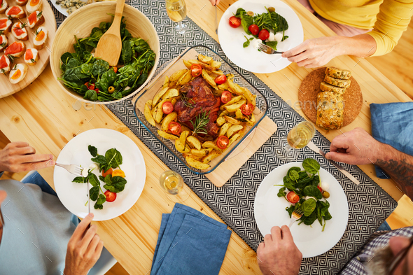 Roasted pork with potatoes on dining table - Stock Photo - Images