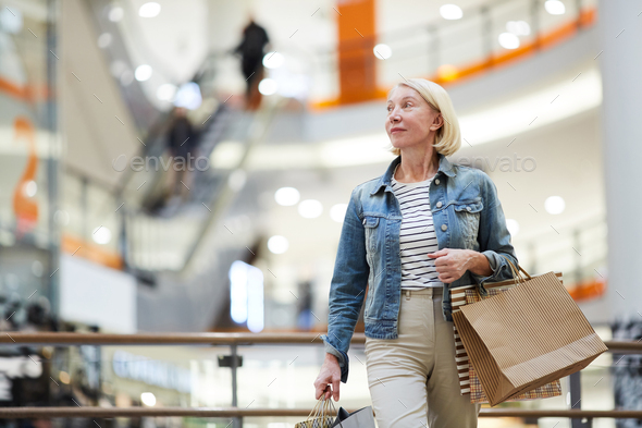 Lady enjoying sales during shopping - Stock Photo - Images