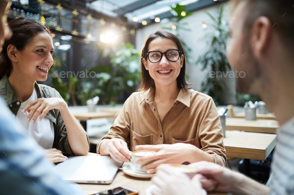 Young entrepreneurs discussing project development - Stock Photo - Images