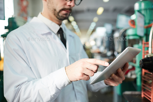 Factory Worker Holding Tablet - Stock Photo - Images