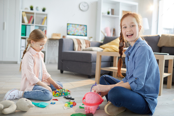 Two Sisters Playing at Home - Stock Photo - Images
