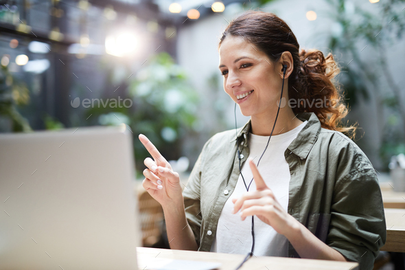 Happy girl having face-to-face conferencing - Stock Photo - Images