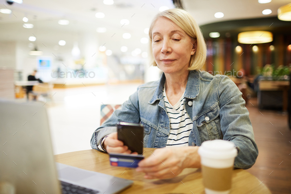 Scanning credit card for online payment - Stock Photo - Images