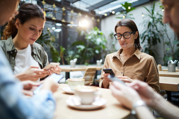 Gathering of gadget-addicted friends - Stock Photo - Images