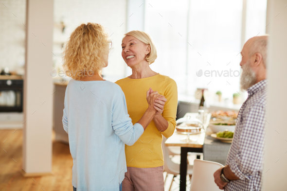 Lady friends excited about gathering - Stock Photo - Images