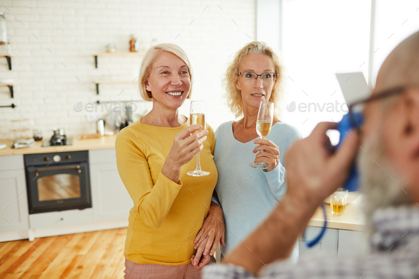 Ladies with flutes posing for camera - Stock Photo - Images