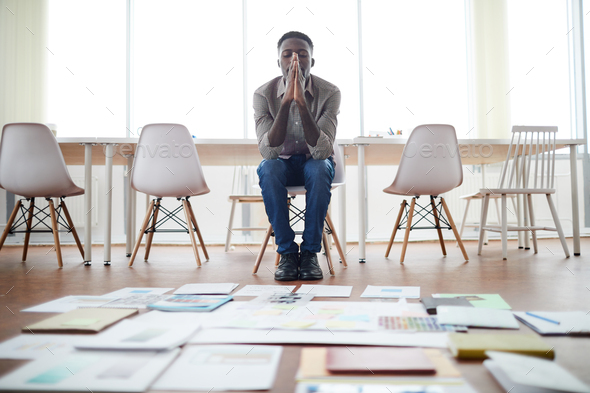African Businessman Planning Project in Empty Office - Stock Photo - Images