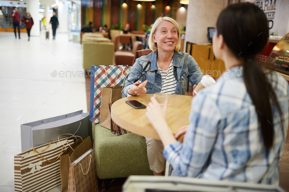 Jolly mature woman sharing emotions from shopping - Stock Photo - Images