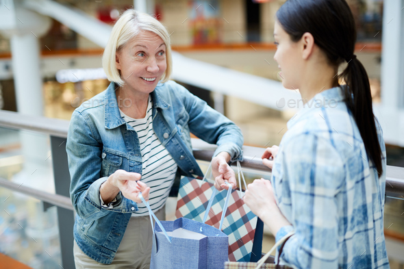Showing purchase to friend - Stock Photo - Images