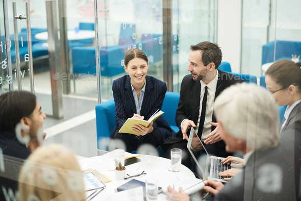 Cheerful Businesswoman in Meeting - Stock Photo - Images