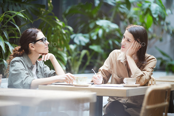 Introspective ladies thinking about strategies - Stock Photo - Images