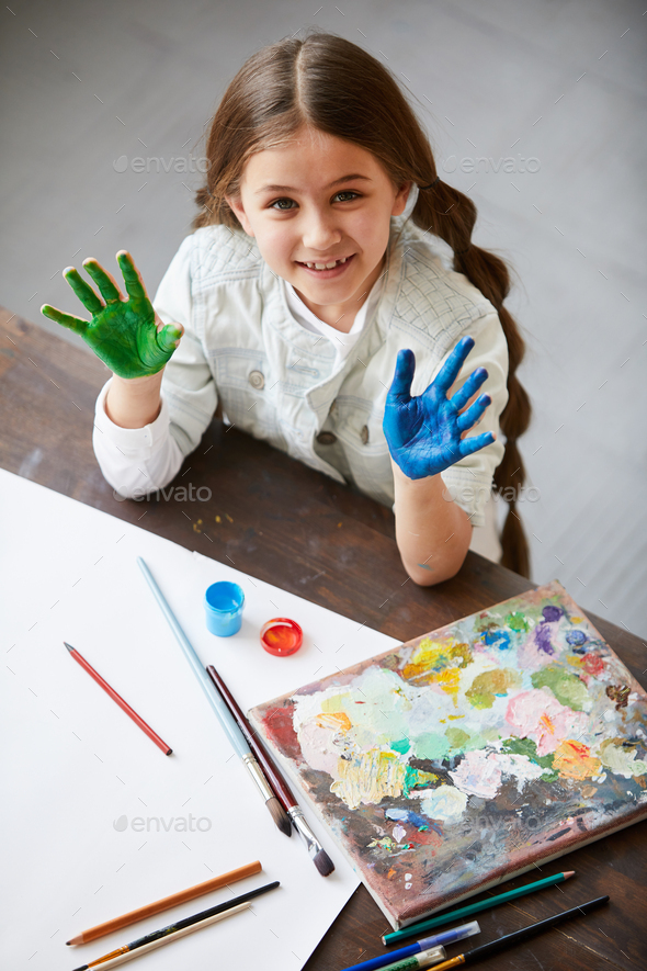 Cute Girl Enjoying painting - Stock Photo - Images