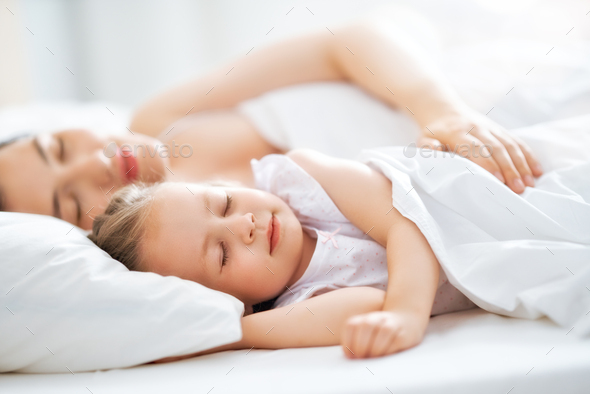 girl and her mother enjoy sunny morning - Stock Photo - Images