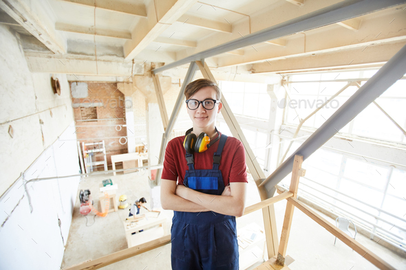 Young carpenter in glasses - Stock Photo - Images