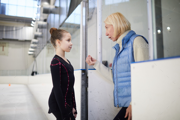 Coach Motivating Little Girl - Stock Photo - Images