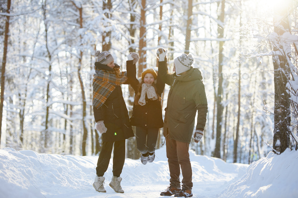 Family Having Fun in Winter Park - Stock Photo - Images