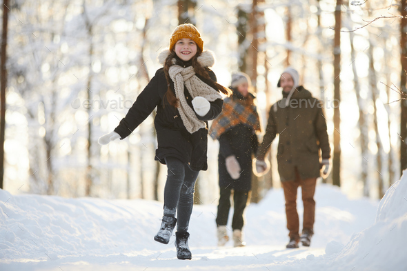 Happy Girl Running in Winter Forest - Stock Photo - Images