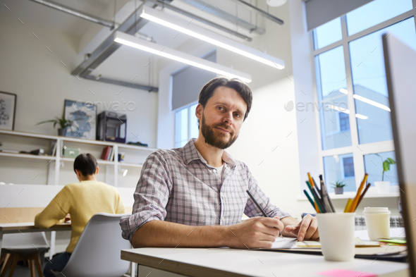 Content male designer working on project - Stock Photo - Images