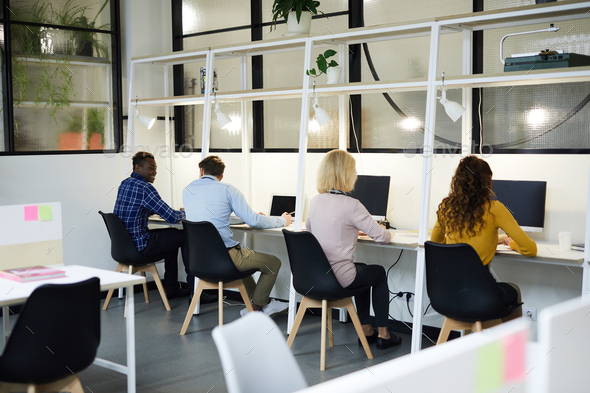Business people sitting in row - Stock Photo - Images