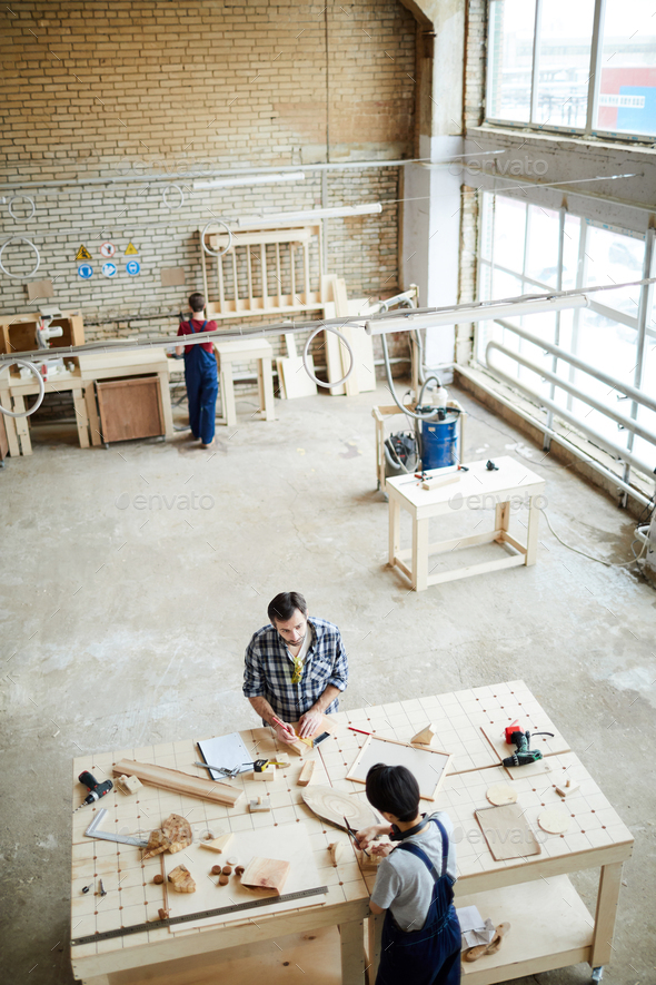 Working with small wooden pieces - Stock Photo - Images