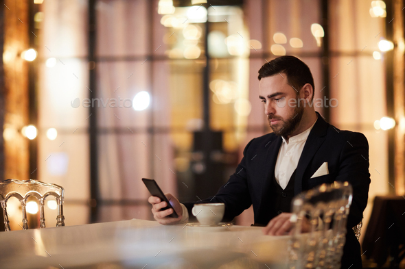 Handsome Gentleman Waiting in Restaurant - Stock Photo - Images