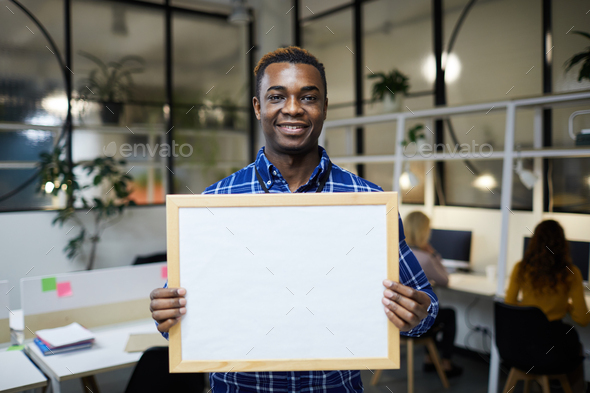 Black man showing blank banner - Stock Photo - Images