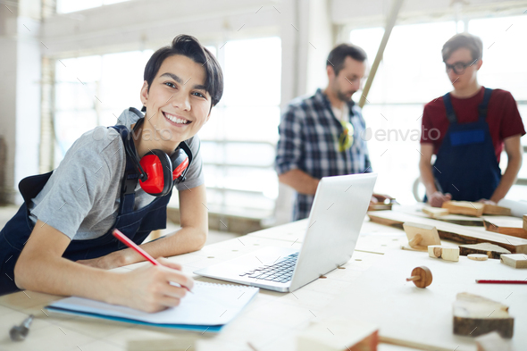 Excited lady enjoying work in carpentry - Stock Photo - Images