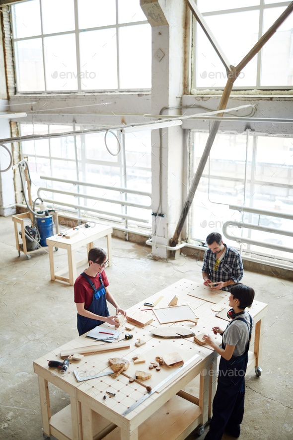 Group of carpenters at work - Stock Photo - Images