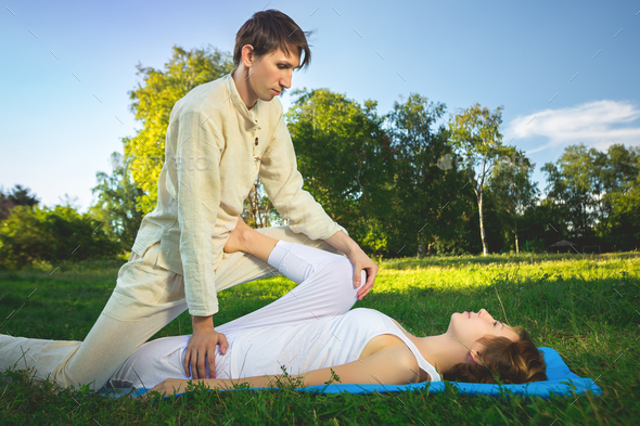 Thai massage with yoga exercises - Stock Photo - Images