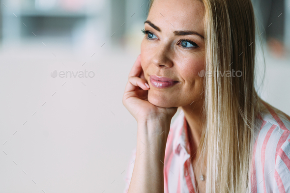 Portrait of cheerful young beautiful blonde woman - Stock Photo - Images