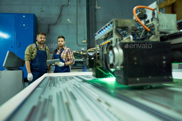 Workers Using Modern CNC Machine at Factory - Stock Photo - Images