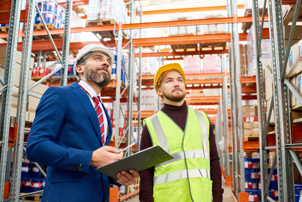 Warehouse Manager Instructing Worker - Stock Photo - Images