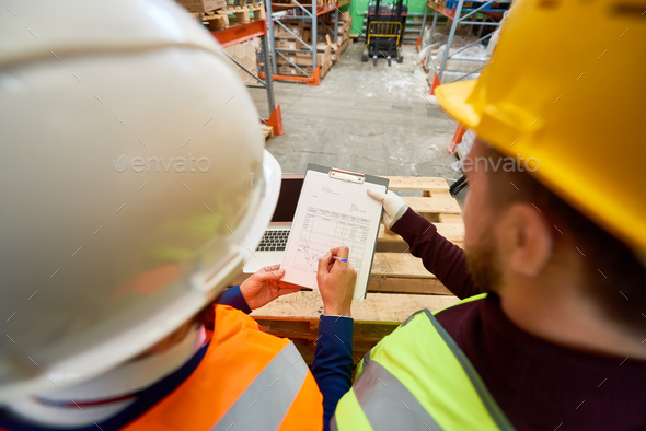 Workers Looking at Plans