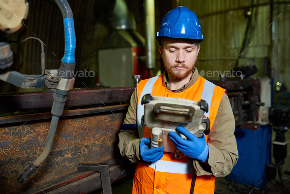 Bearded Worker Operating Machine - Stock Photo - Images