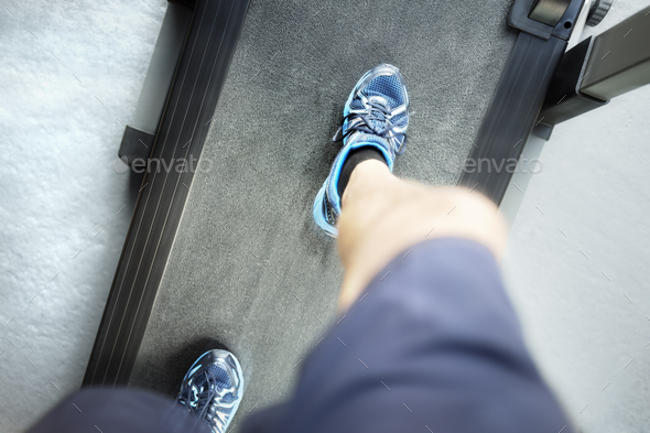 Running on treadmill looking down - Stock Photo - Images