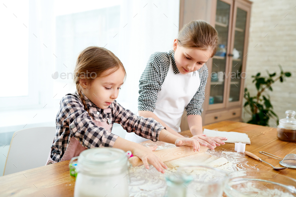 Little Sisters Preparing Cake