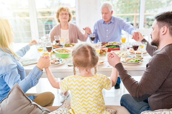Family Praying at Family Dinner - Stock Photo - Images