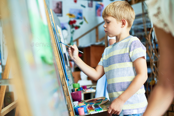 Cute Little Boy Painting Picture - Stock Photo - Images