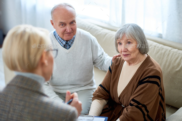 Woman consulting senior people - Stock Photo - Images