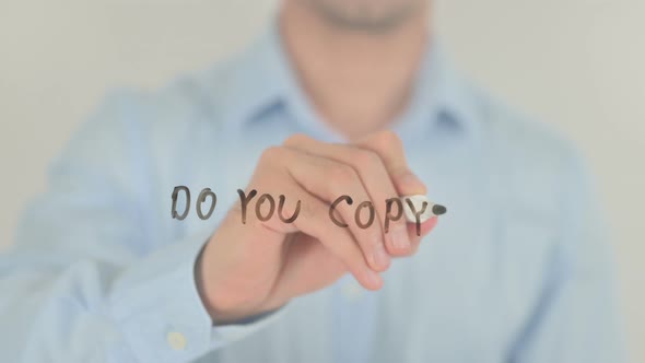 Do You Copy, Man Writing on Transparent Screen alt