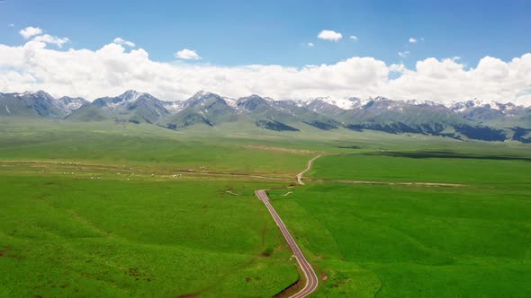 Mountains and grassland in a sunny day alt
