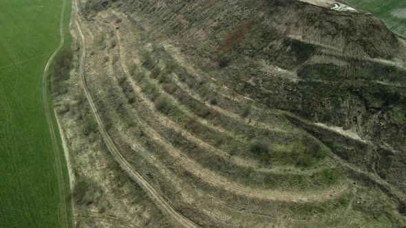 Conserved landfill for household waste. A mound of rubbish. Aerial photography. alt
