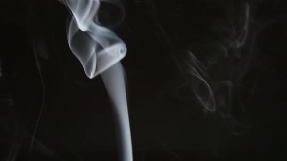 Smoke steam into cigarette smoke on a black background