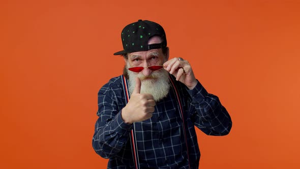 Mature Old Bearded Grandfather Showing Thumbs Up and Nodding in Approval Successful Good Work alt