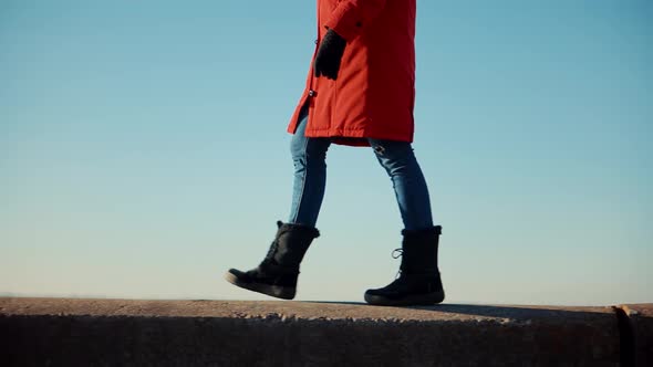 Stylish Woman Legs In Winter Boots Walking On Vacation Holiday In Cold Winter Day. alt