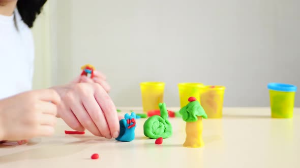 Mother and Child Playing with Figures From Plasticine, Dough, Mixing Models alt