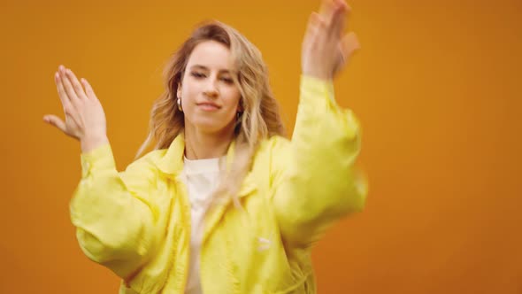 Woman Professional Dancer Dancing in Studio Against Yellow Background alt