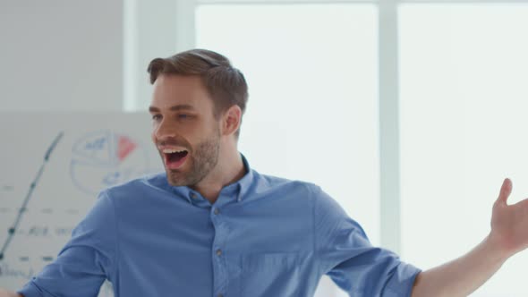 Happy Male Speaker Making Presentation Office alt