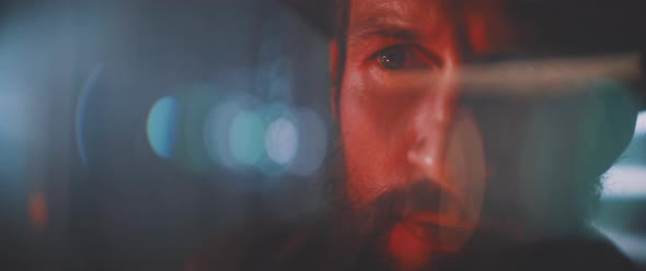 Close up of man using flashlight towards camera alt